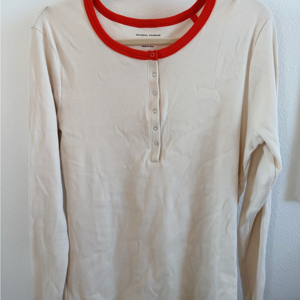 Universal Standard Cream Henley with Orange Trim